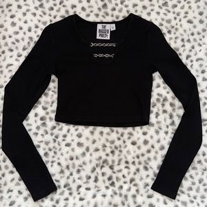 This is a black crop top with chains in the front size small